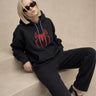 Spiderman hoodie for women front sitting pose