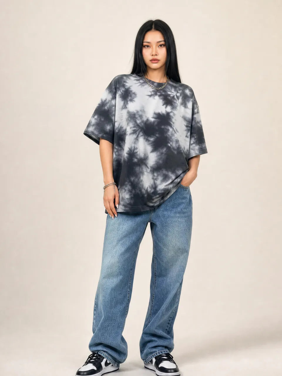 Black and white tie-dye T-shirt with an irregular all-over dye pattern